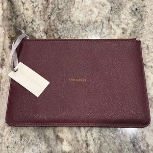 Katie Loxton’s Perfect Pouch in plum shimmer